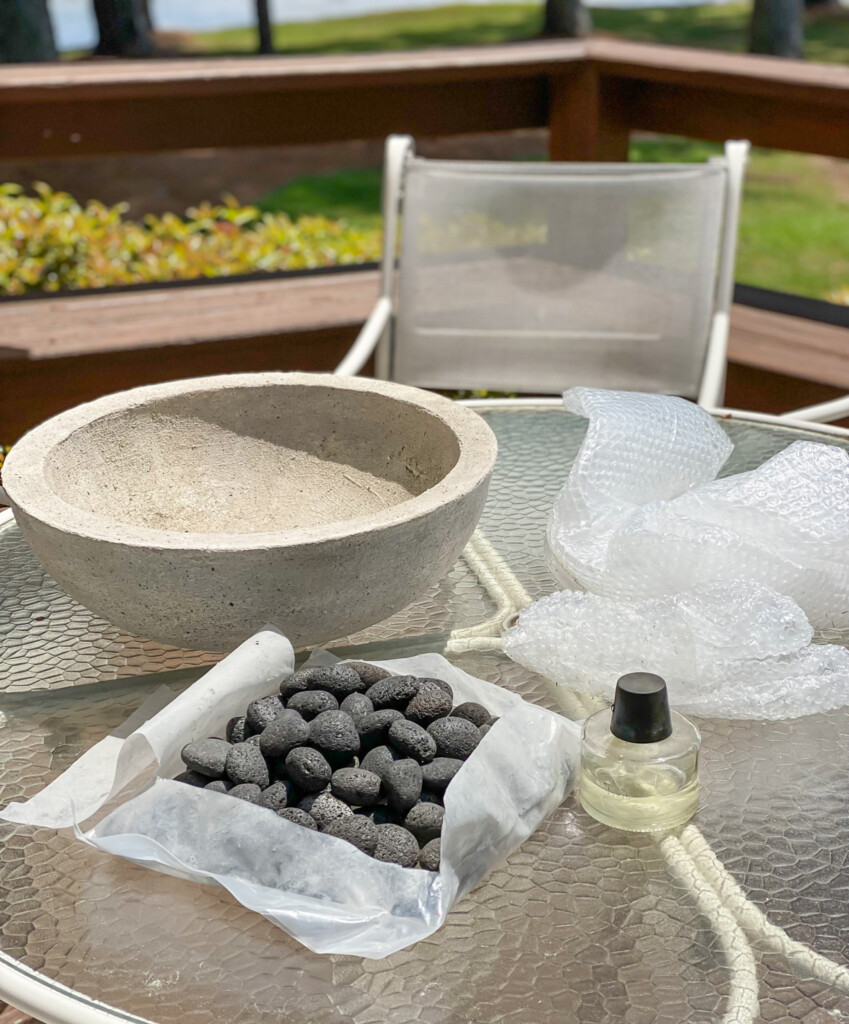 a large bowl, rocks or stones an a tabletop torch are what you need to assemble a DIY tabletop fire bowl.