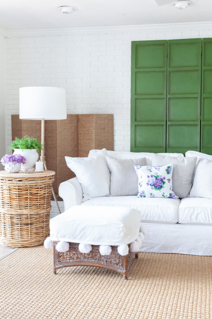 Living room fireplace wall decorated for summer.