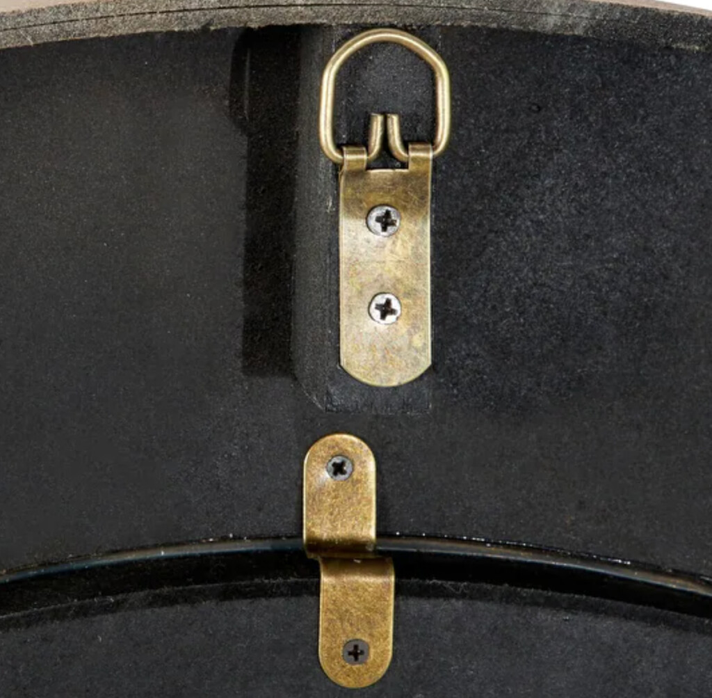 Brass hanger on the back of a large wall clock