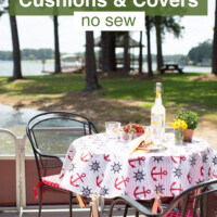 Outdoor wrought iron patio table and chairs set for lunch along the shores of a lake.