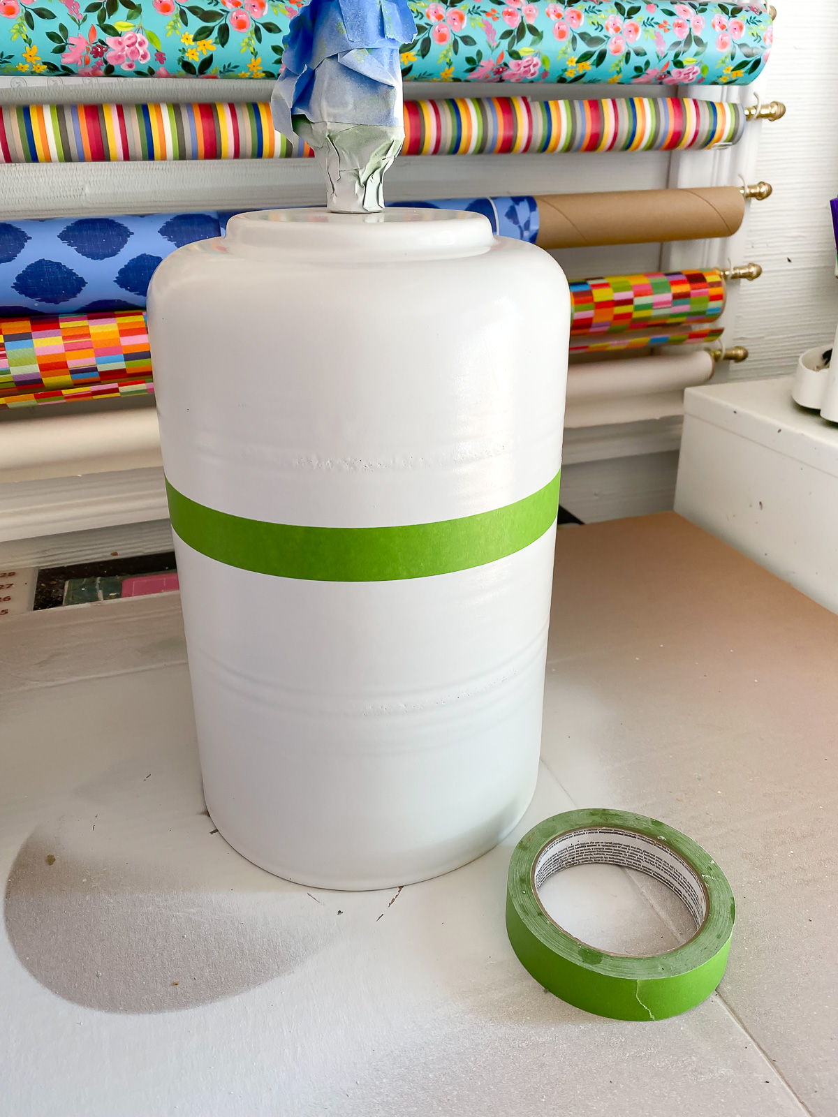 painted lamp base with painters tape to mask for second color.