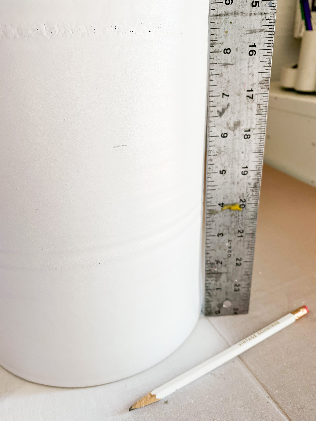 Pencil marks on lamp base to prepare for paint.
