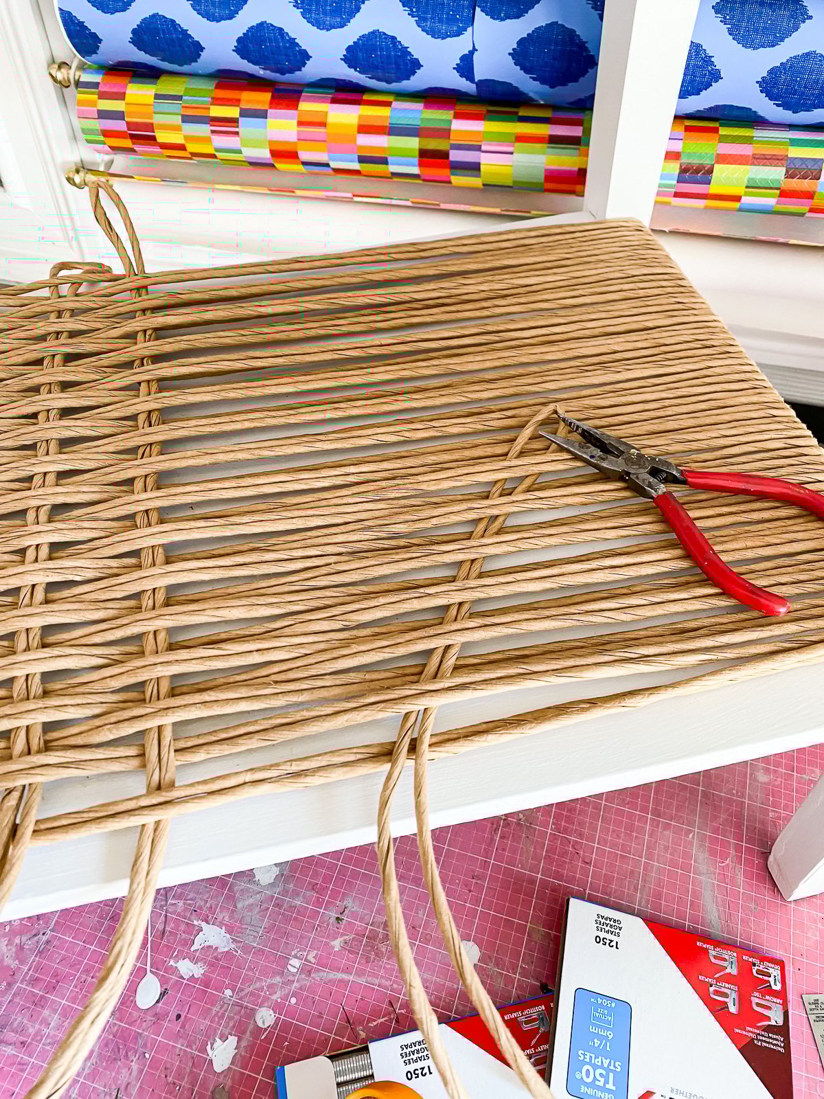 tip on pulling fiber rush as you weave it on the side table.