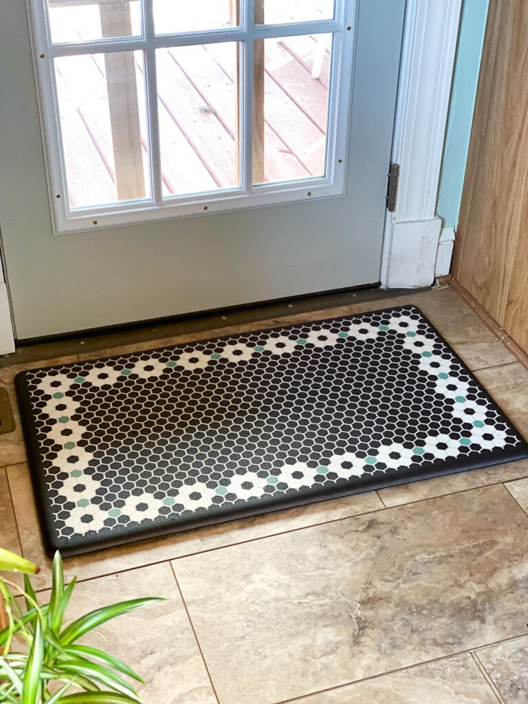 gel mat with tile pattern on floor in front of French door