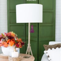 colorful fall decor ideas. Decorative green paneled screen with floor lamp in fall colors.