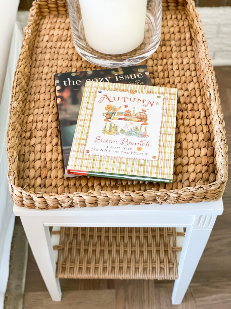 wicker tray table with two Autumn books on it