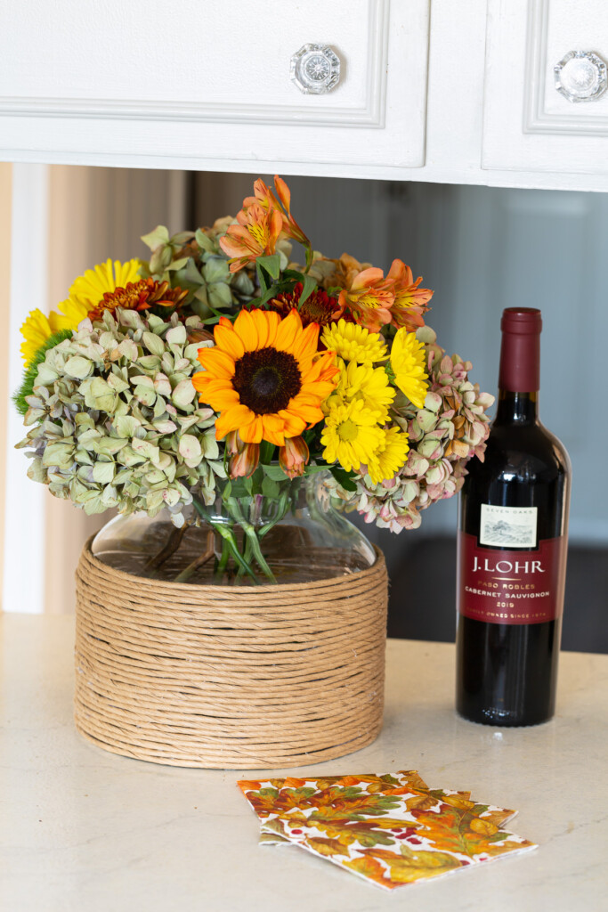 fall flowers in paper cord wrapped vase