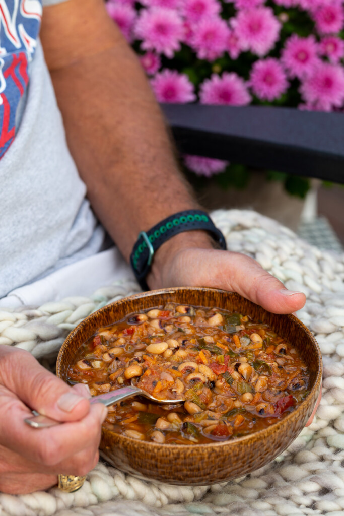 man holding a bowl of soup