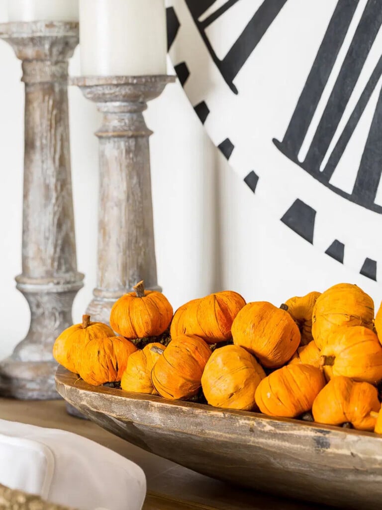 mini pumpkins in a wood dough bowl