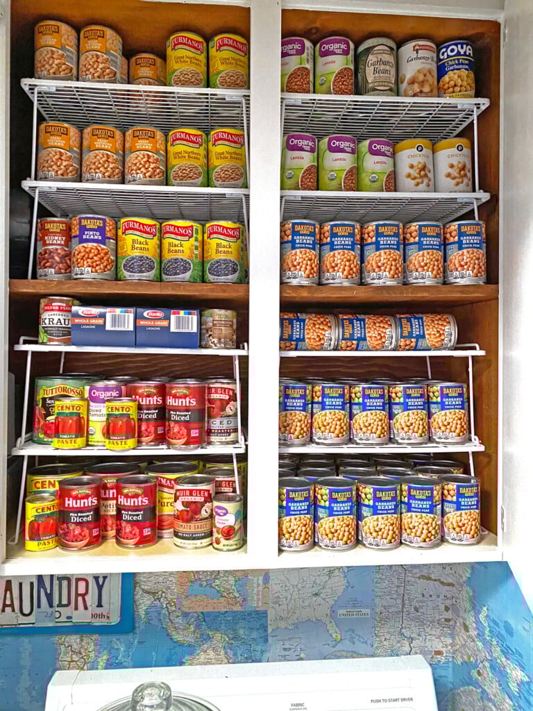 canned storage in a cabinet in a laundry room
