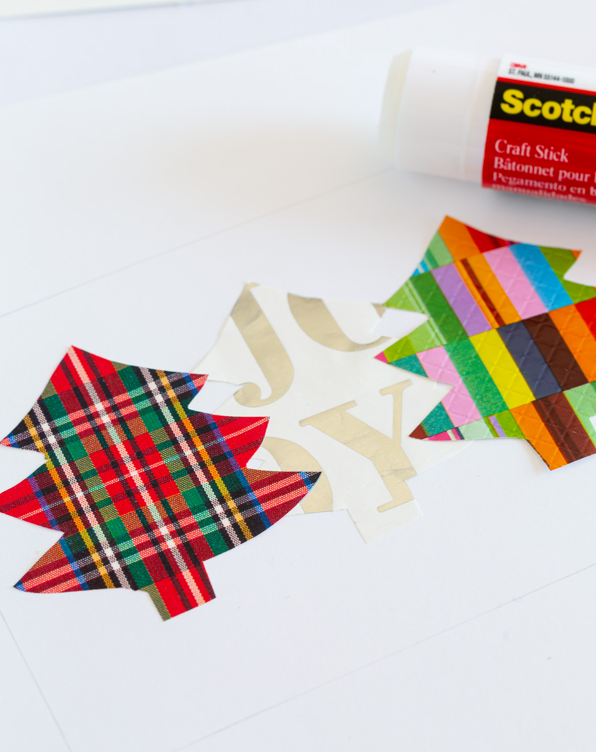 glue gift wrap cut out trees onto card