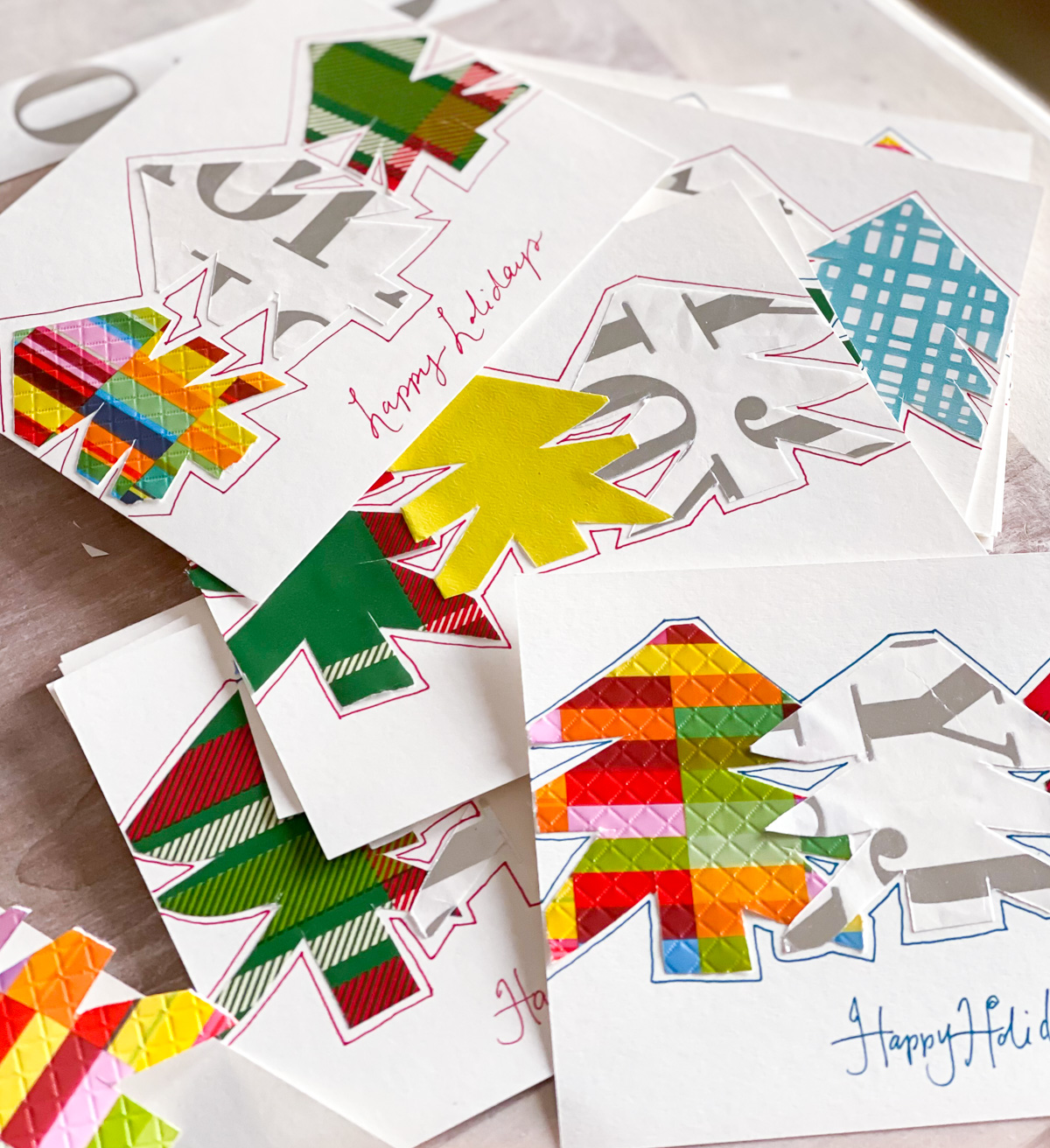 A collection of DIY Christmas cards on a table.