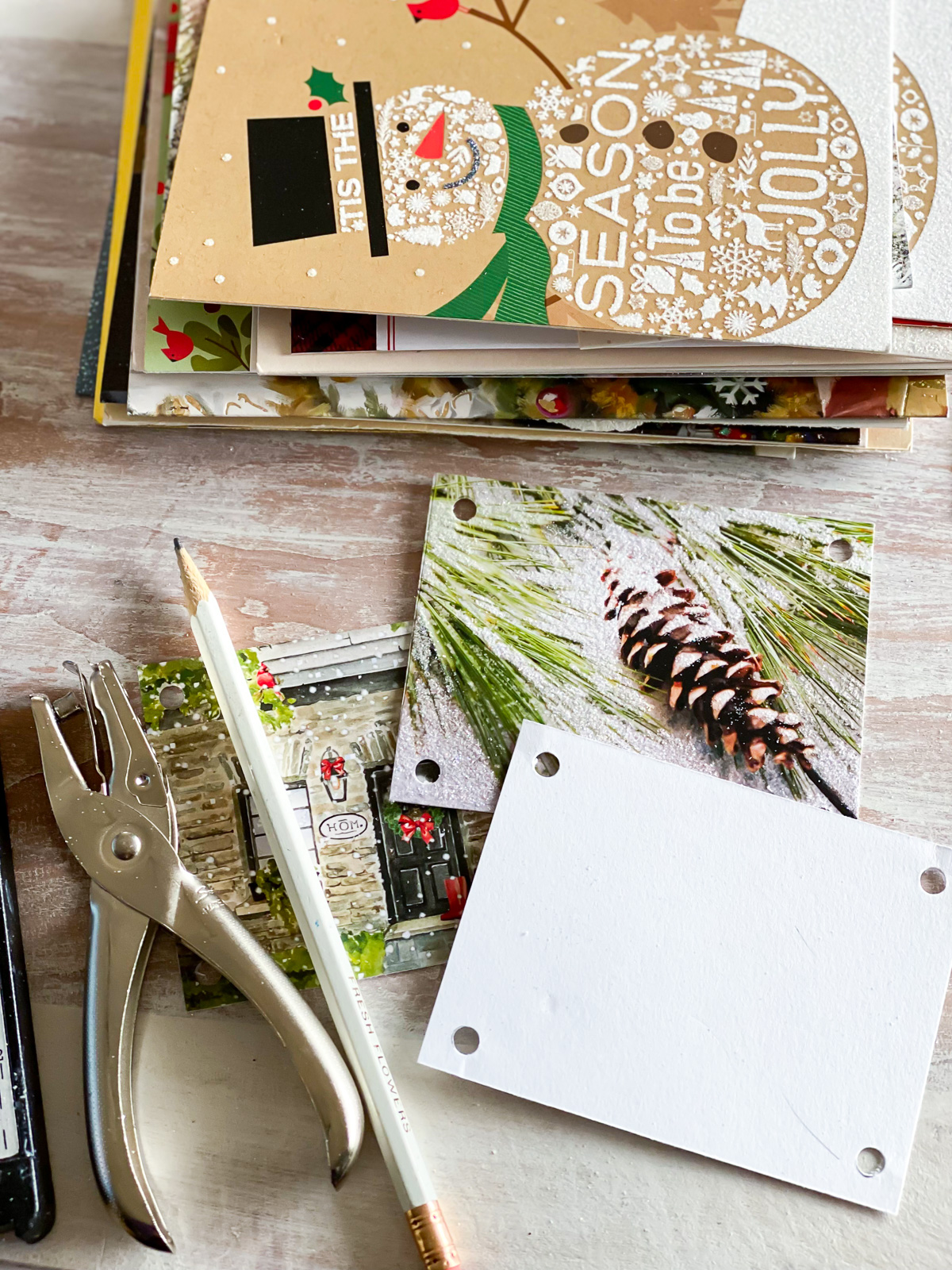 Christmas card craft making a votive candle surround for a table setting.