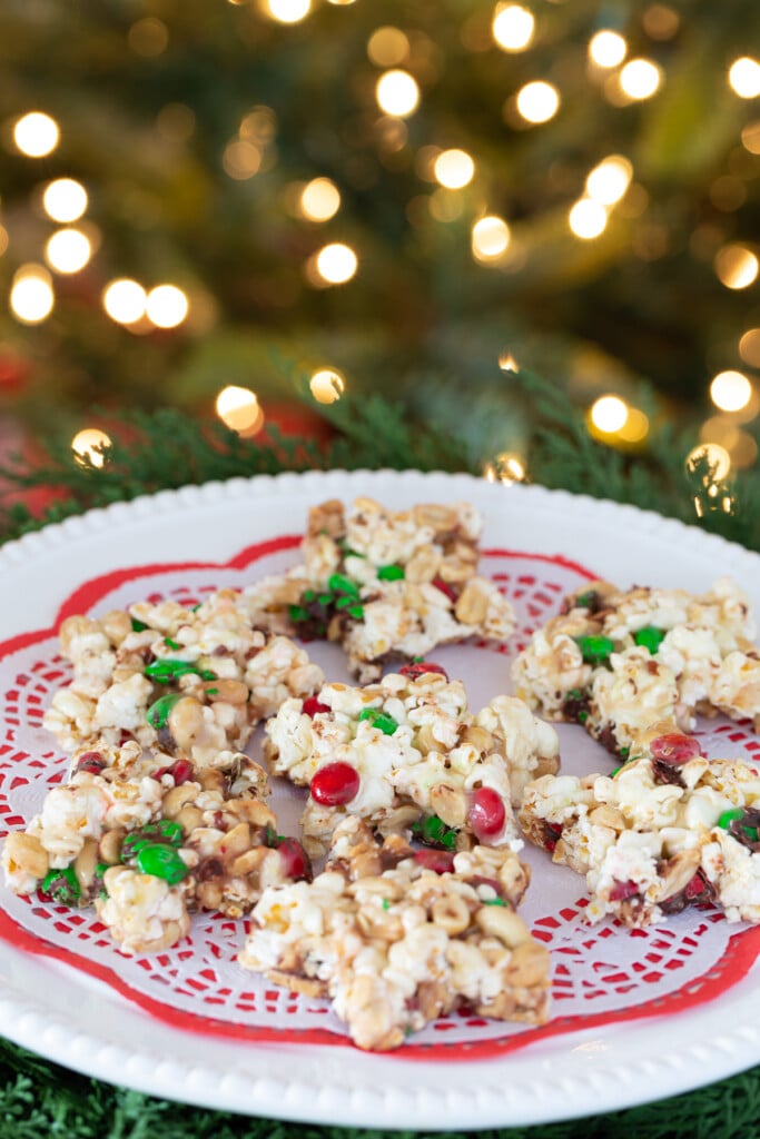 Christmas popcorn cake cut into star shapes on a serving platter. 