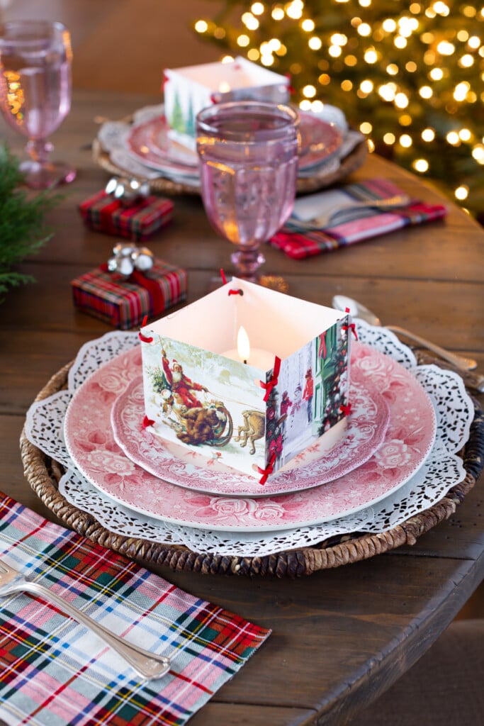 red and white dinner plates set on dining table for Christmas