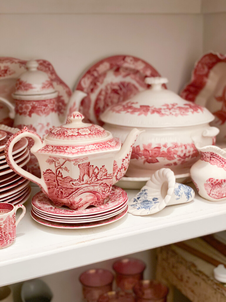 Red and white vintage china in china closet