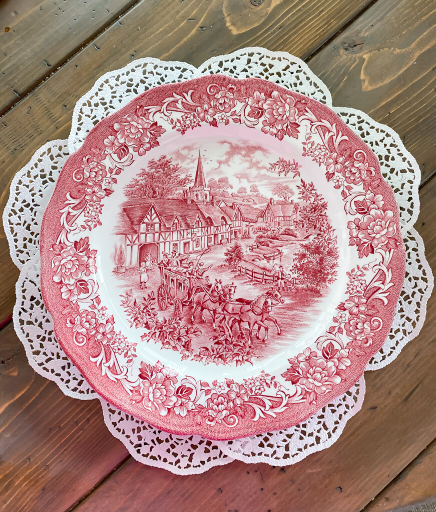 Vintage red and white plate on DIY round paper doily placemat
