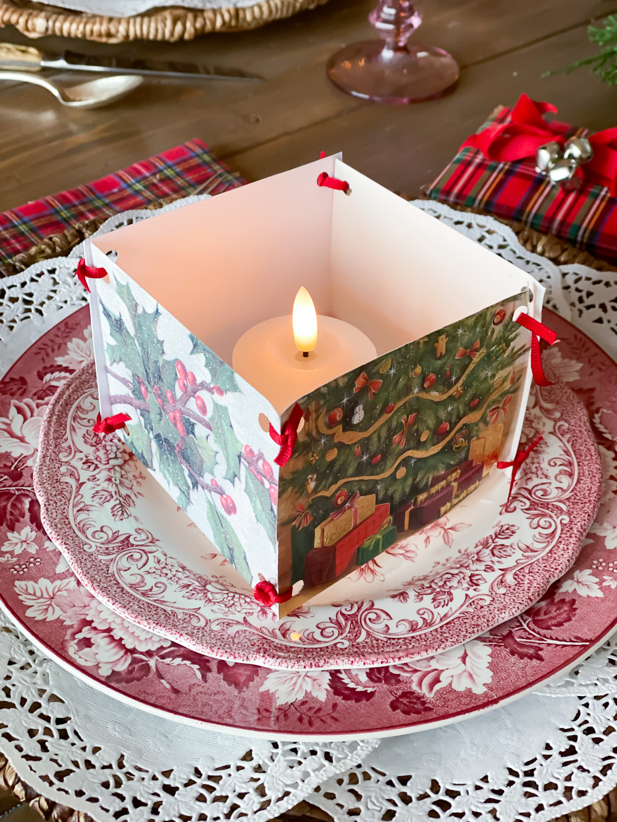 Old Christmas cards made into a votive candle holder decoration.