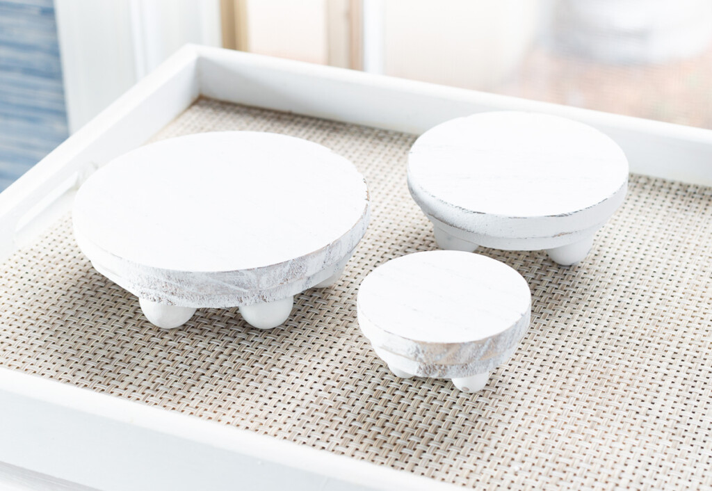 3 wood risers that can be used to add height and focus to decor displayed on tables and kitchen counters.