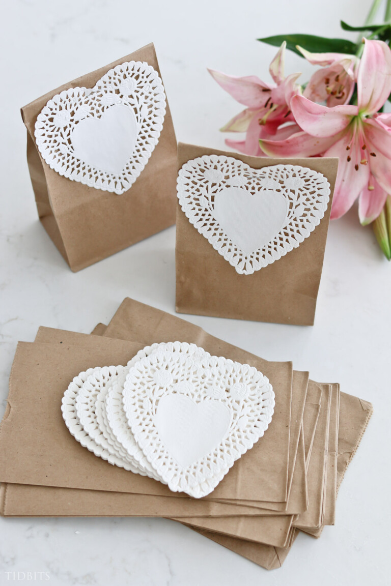 white heart doilies on brown paper lunch bags