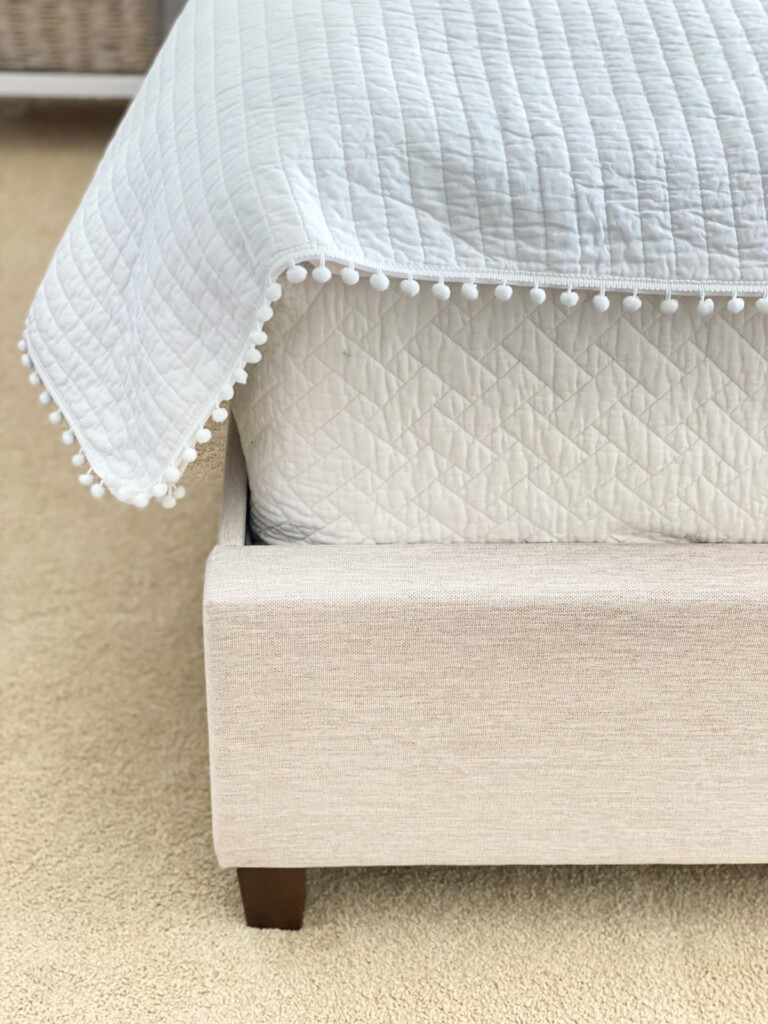 end of bed - mattress and frame with bedding