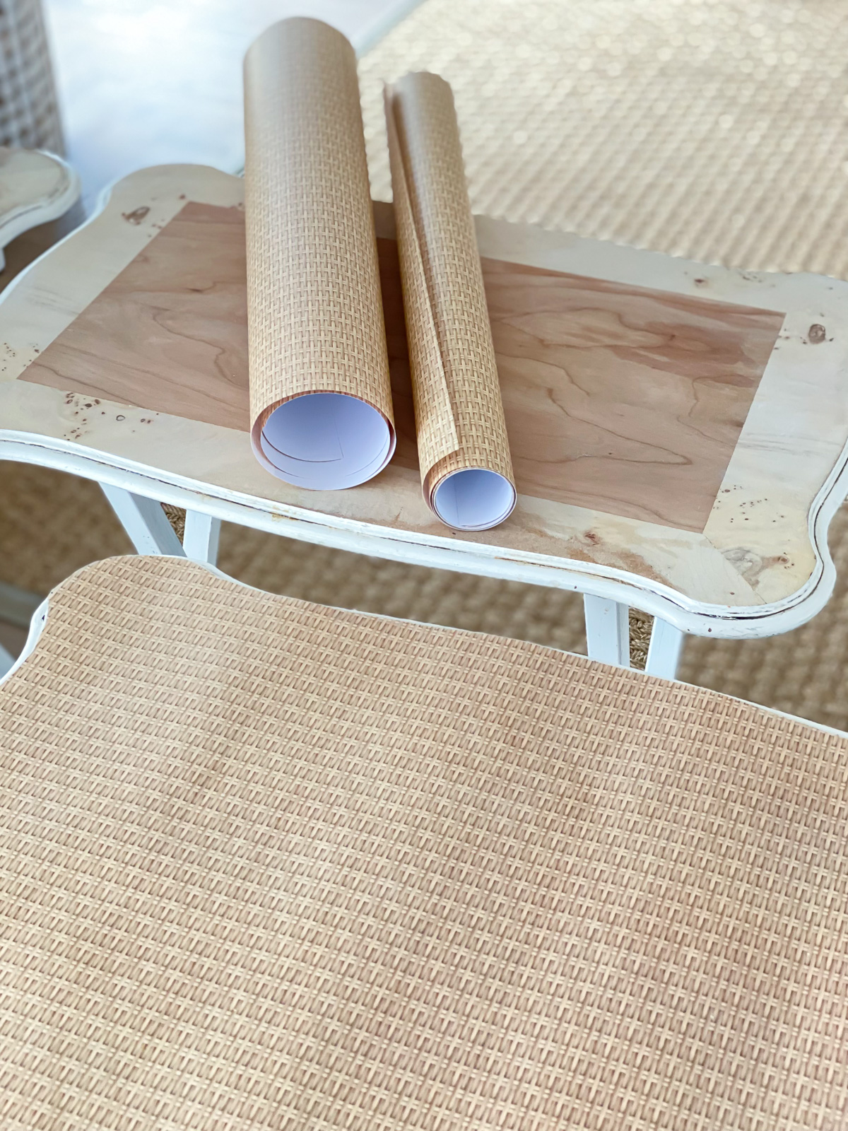 Wood tray table set getting a makeover using wicker print gift wrap and decoupage.