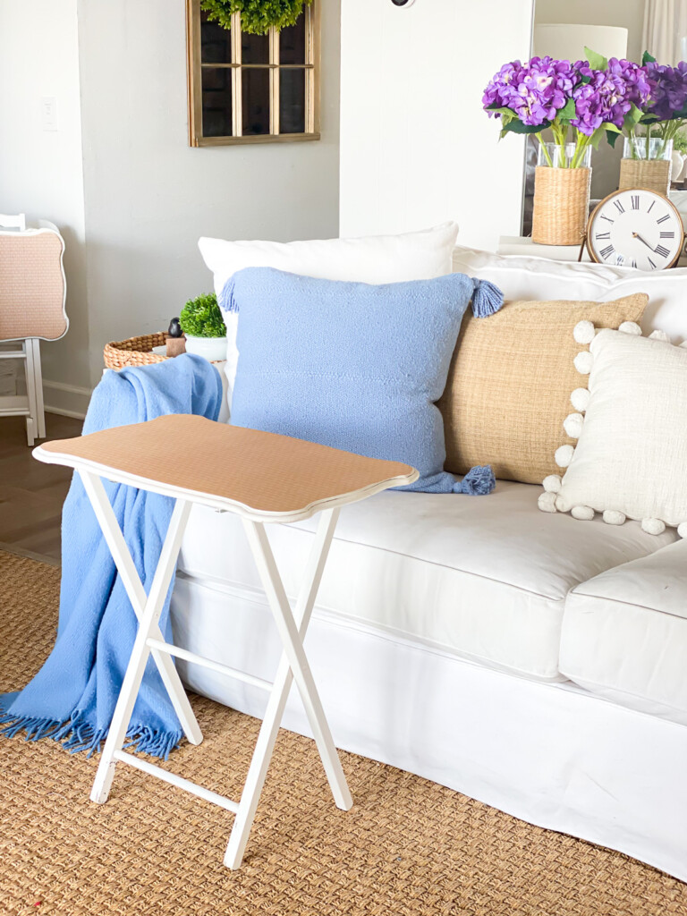 Old white tray table gets a makeover using wallpaper.