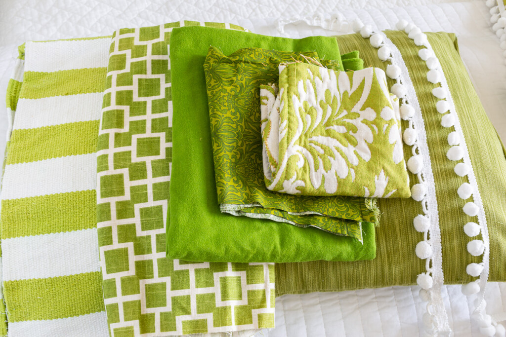 close up of green and white folded fabric yardage.