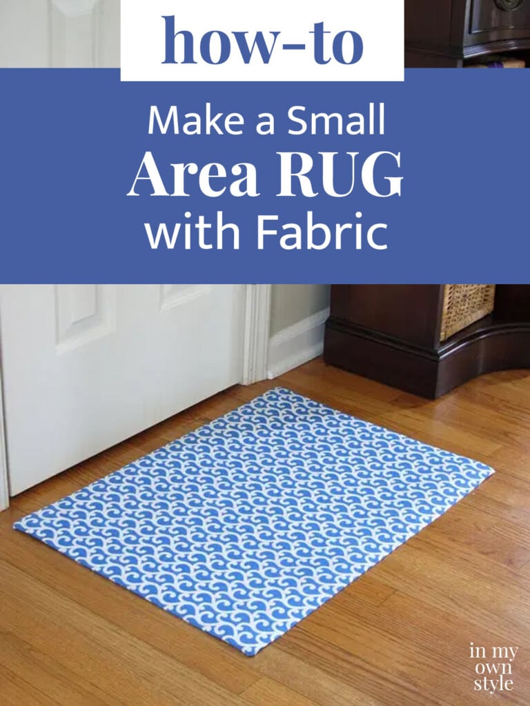 Blue and white area rug made of fabric on the floor in front of a door. Text overlay says hoe to make a small area rug with fabric.
