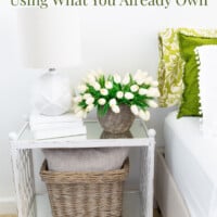 green and white decorated room - text overlay says doable decorating ideas using what you already own.