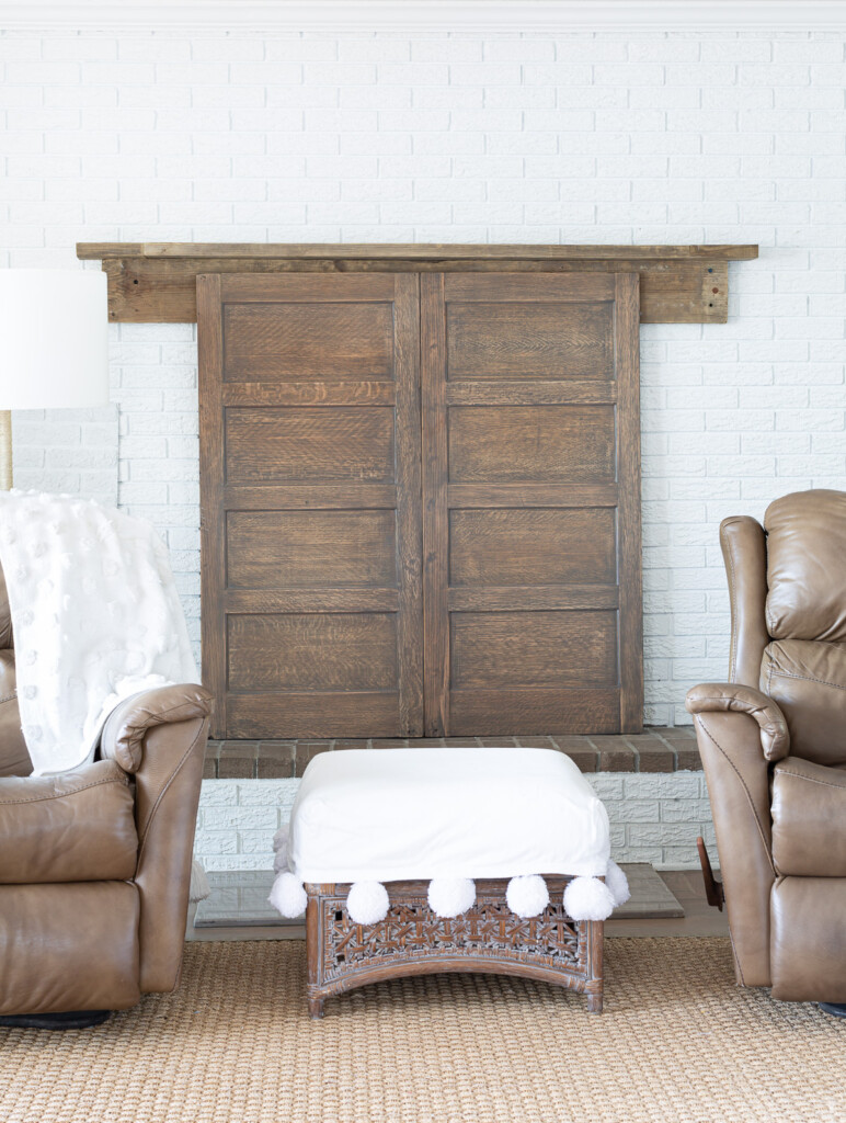 Two wood panels from the sides of a old wood file cabinet made into a fireplace cover.