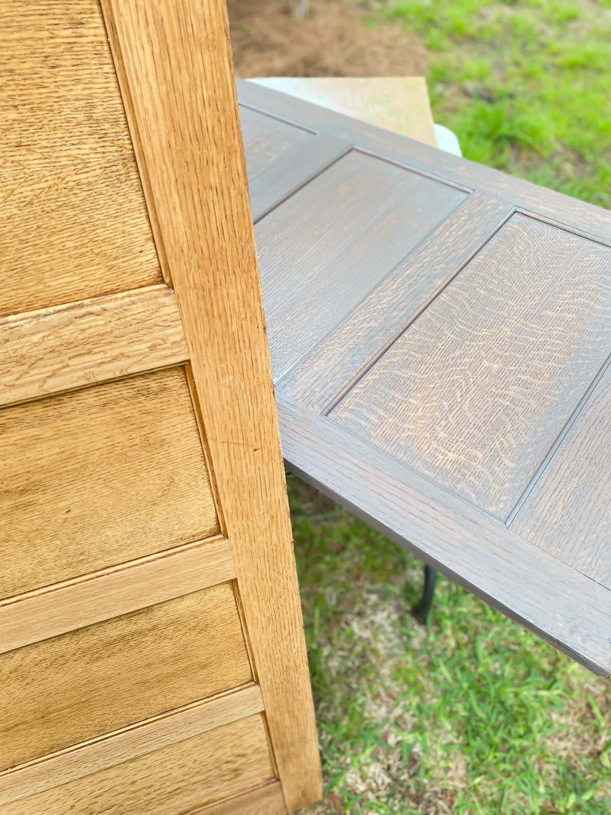 A close up of a stripped raised wood panel and one that is stained in a driftwood shade.