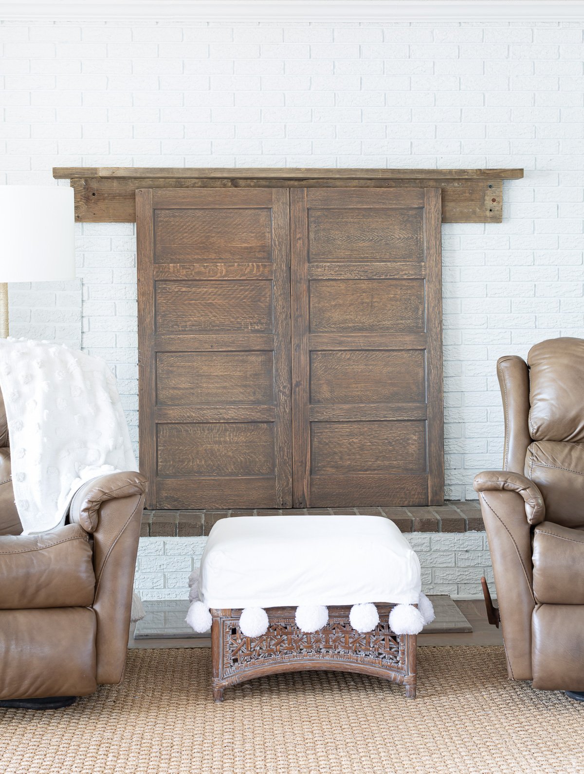 Two wood panels from the sides of a old wood file cabinet made into a fireplace cover.