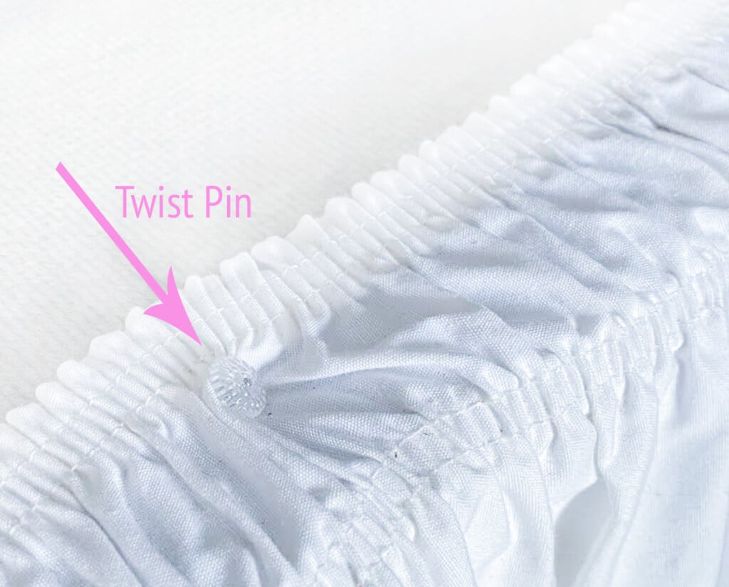 how to use a twist pin to hold a bed skirt or bed ruffle on a bed.