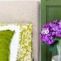 Easy DIY upholstered headboard using any fabric to coordinate with bedding.