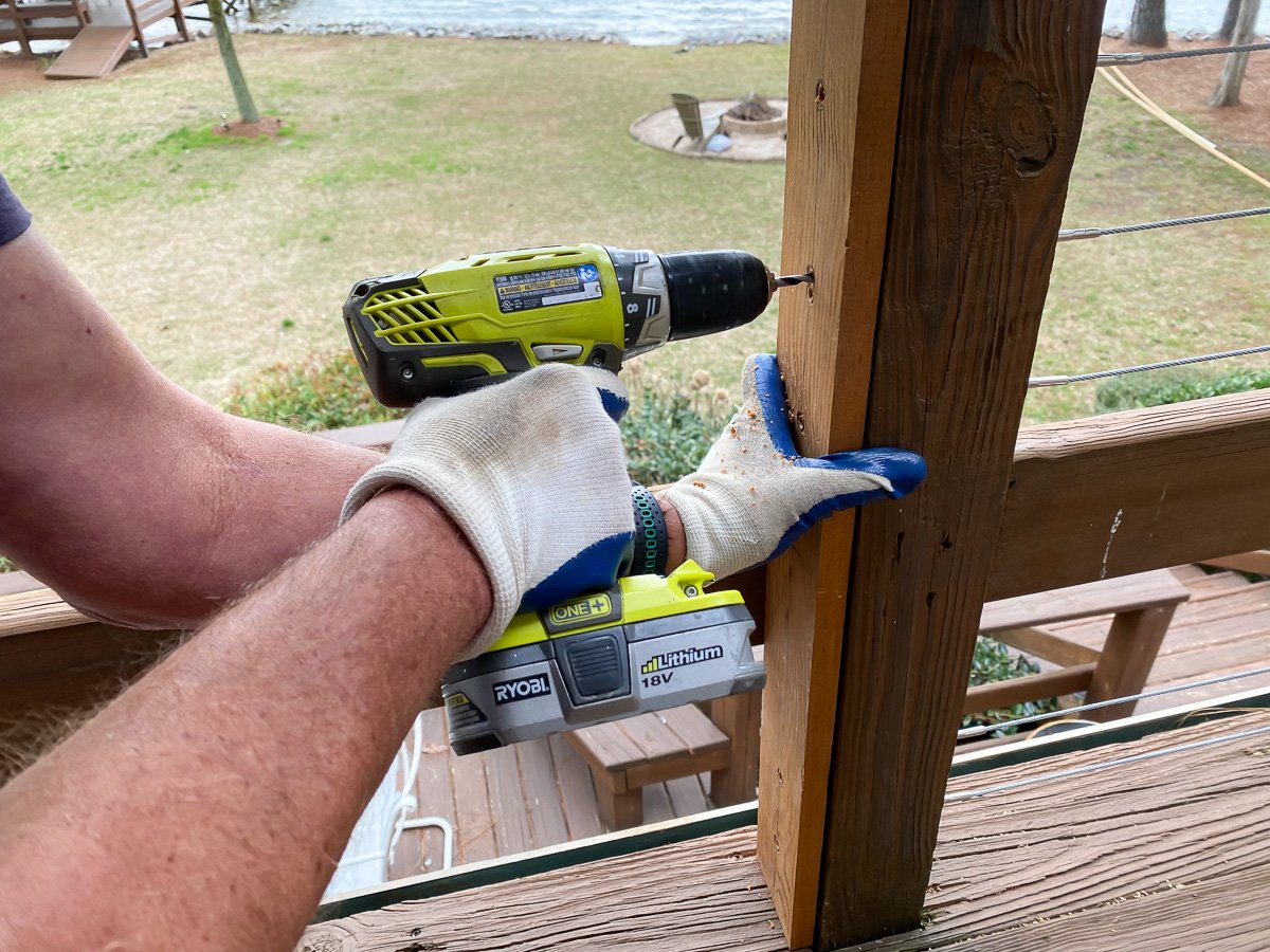 drilling the holes into the post with wood hole template that you make for spacing.