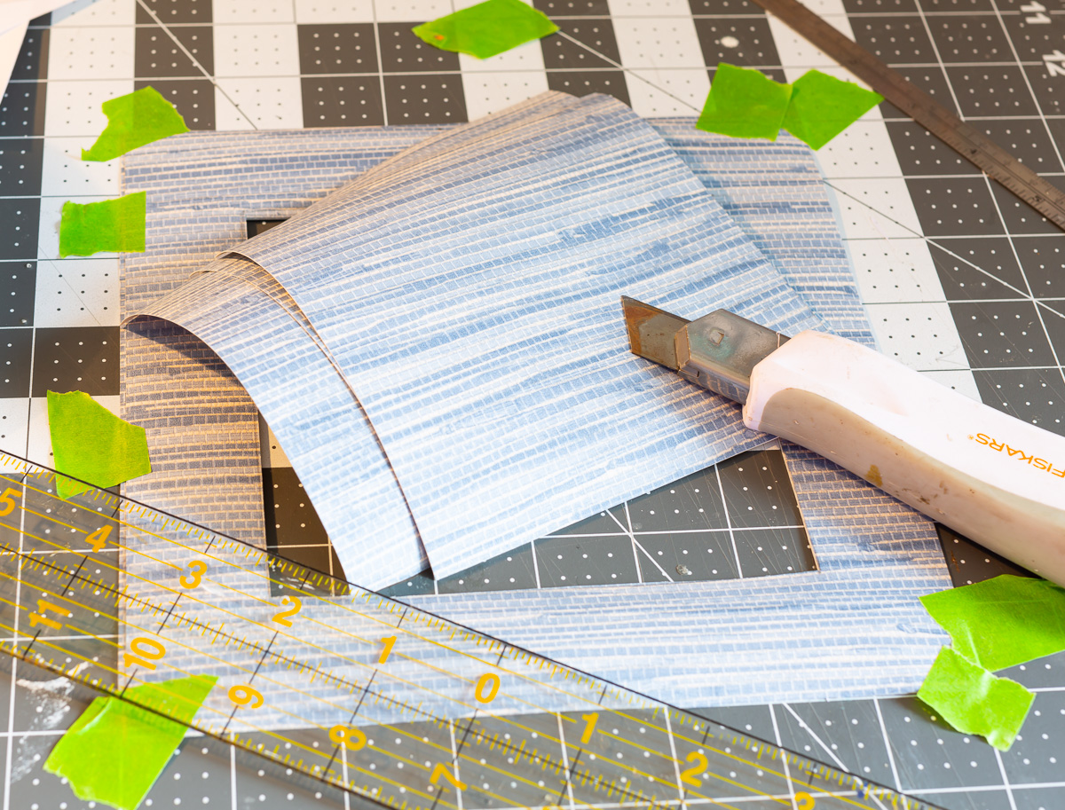 cut wallpaper to use as a DIY picture frame mat.