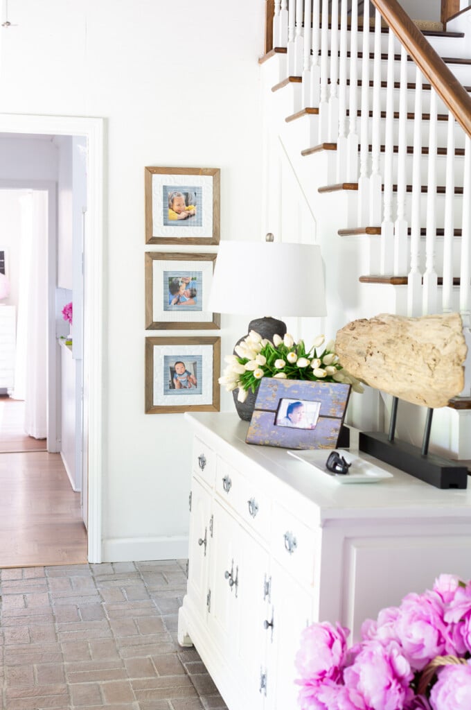 Display family pictures wall ideas in a foyer.