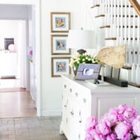 Decorating photo frames from thrift stores to hang on walls.