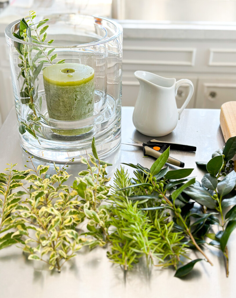 materials needed to make a glass candle vase DIY to use as a summer table centerpiece or table decoration.