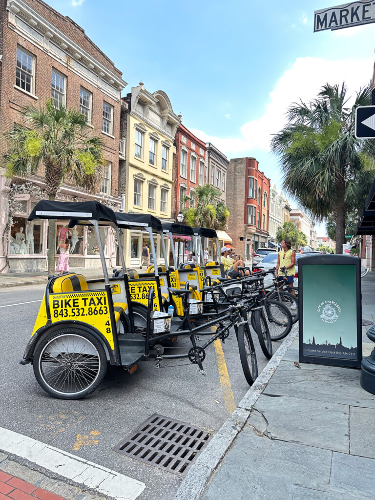 a line up of yellow and black bike taxis in Charleston, SC