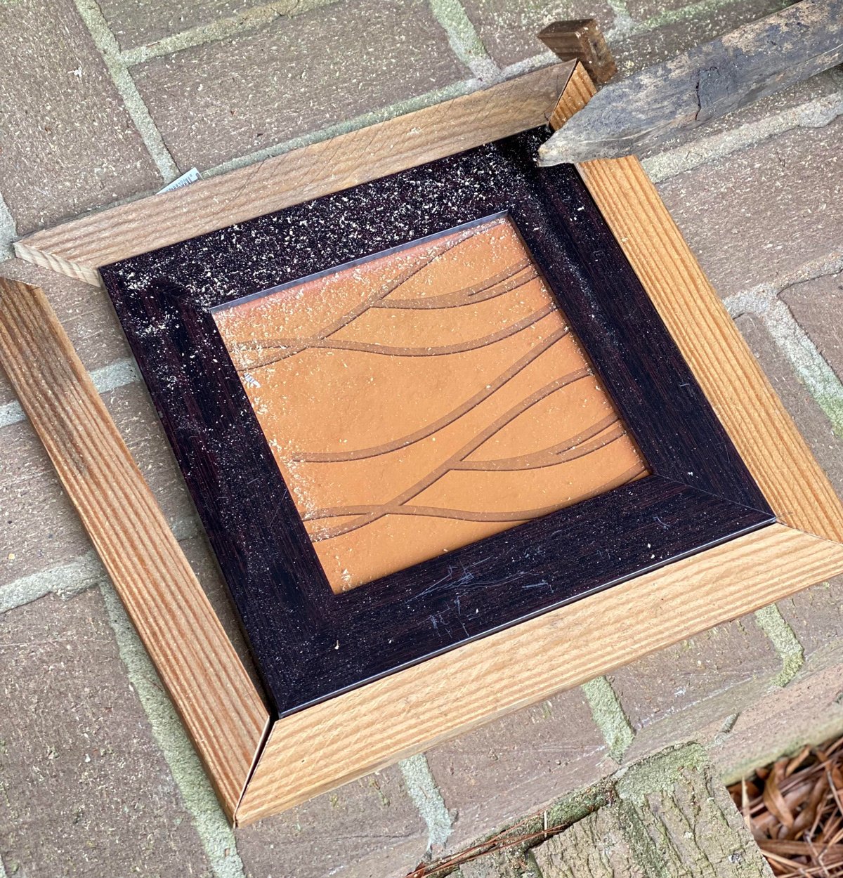 scrap wood cut to fit around a plain black photo frame