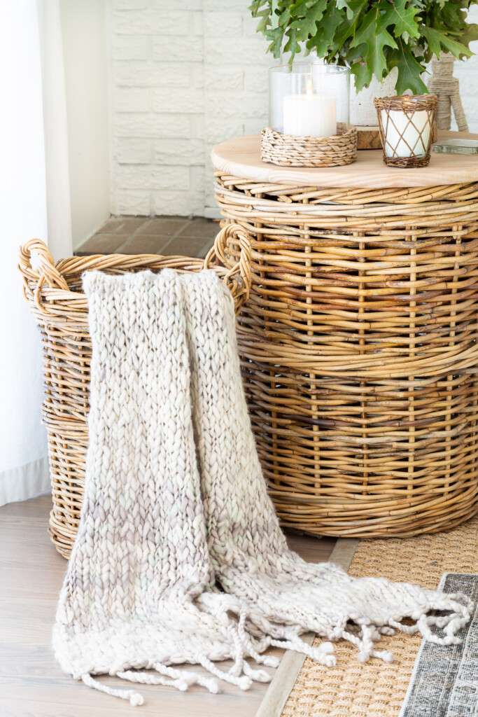 2 large baskets in living room. One is used as a side table, the smaller one as a place to keep a throw blanket out of the way, but handy when needed.