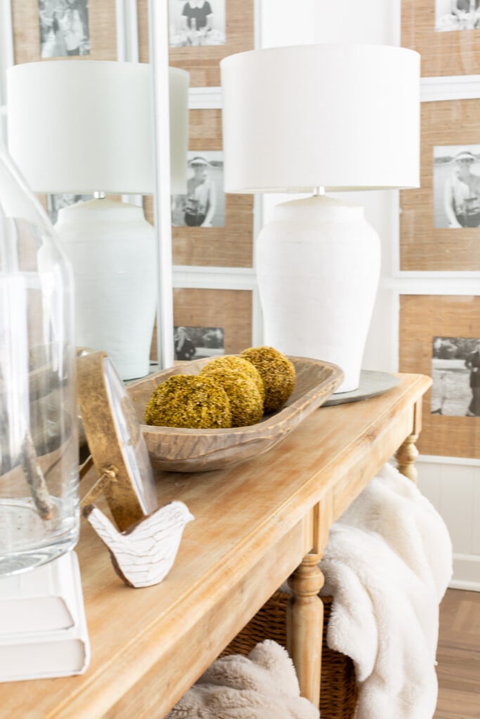 Console table in fall decorated living room.