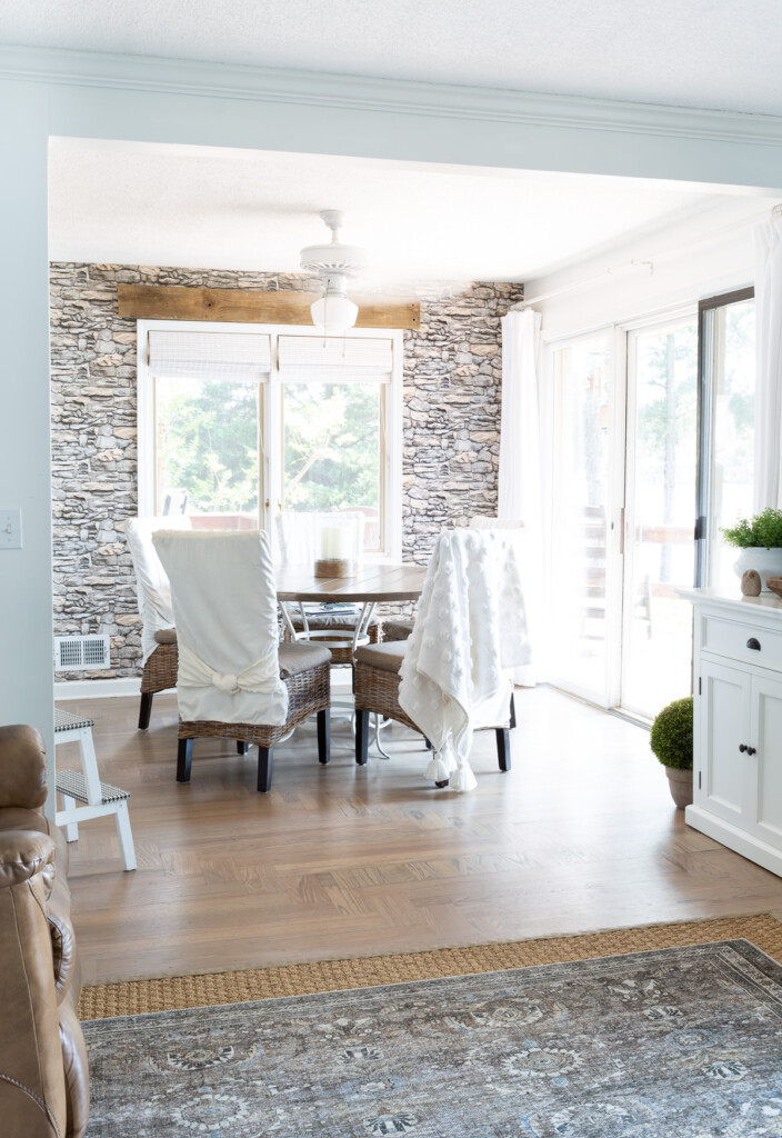 Minimal fall decor in the kitchen with stacked stone wallpaper on an accent wall.