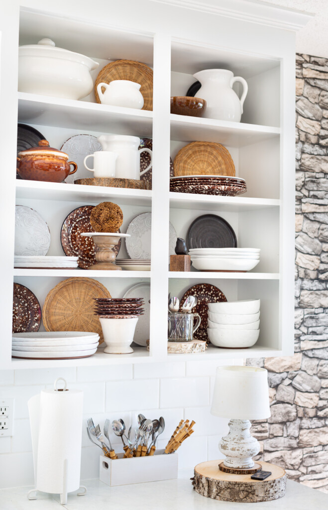 Open shelving in a kitchen decorated for fall.