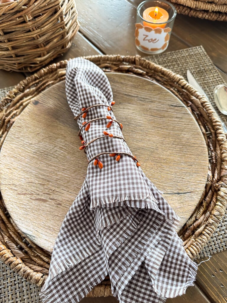 Looking down at a Thanksgiving place setting in a rustic style.