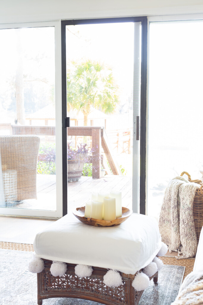 Black framed screen door in living room.