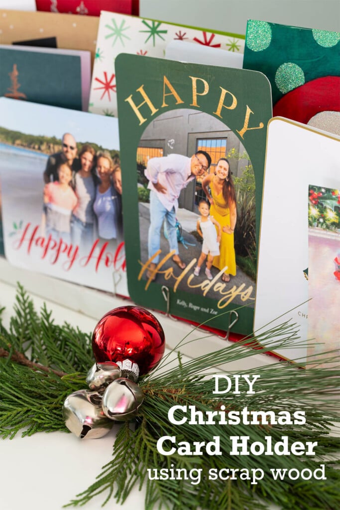 Close up photo of Christmas cards on holder. Text overlay says DIY Christmas Card holder using scrap wood.