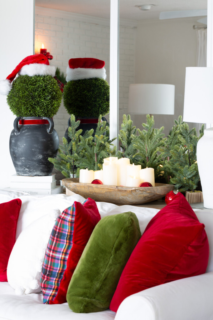 Large topiary ball on black vase to resemble Santa makes for easy holiday decor.